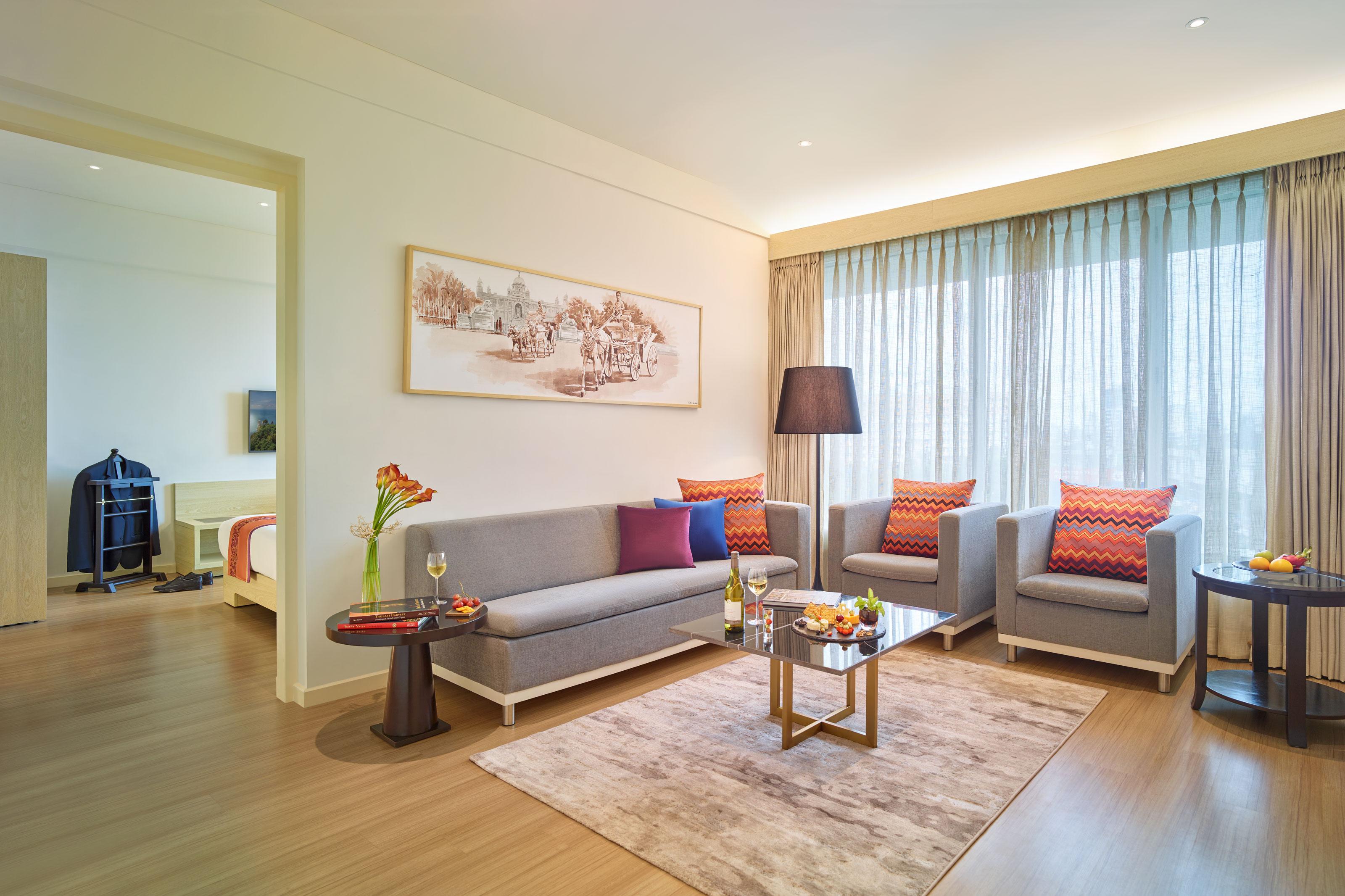 Vivanta Kolkata Em Bypass Esterno foto A living room in a serviced apartment in Beijing, China